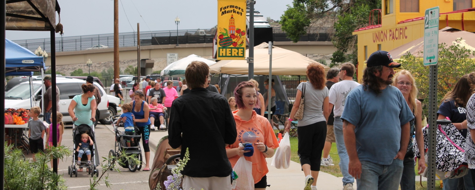 Shoppers stroll between pop-up booths.