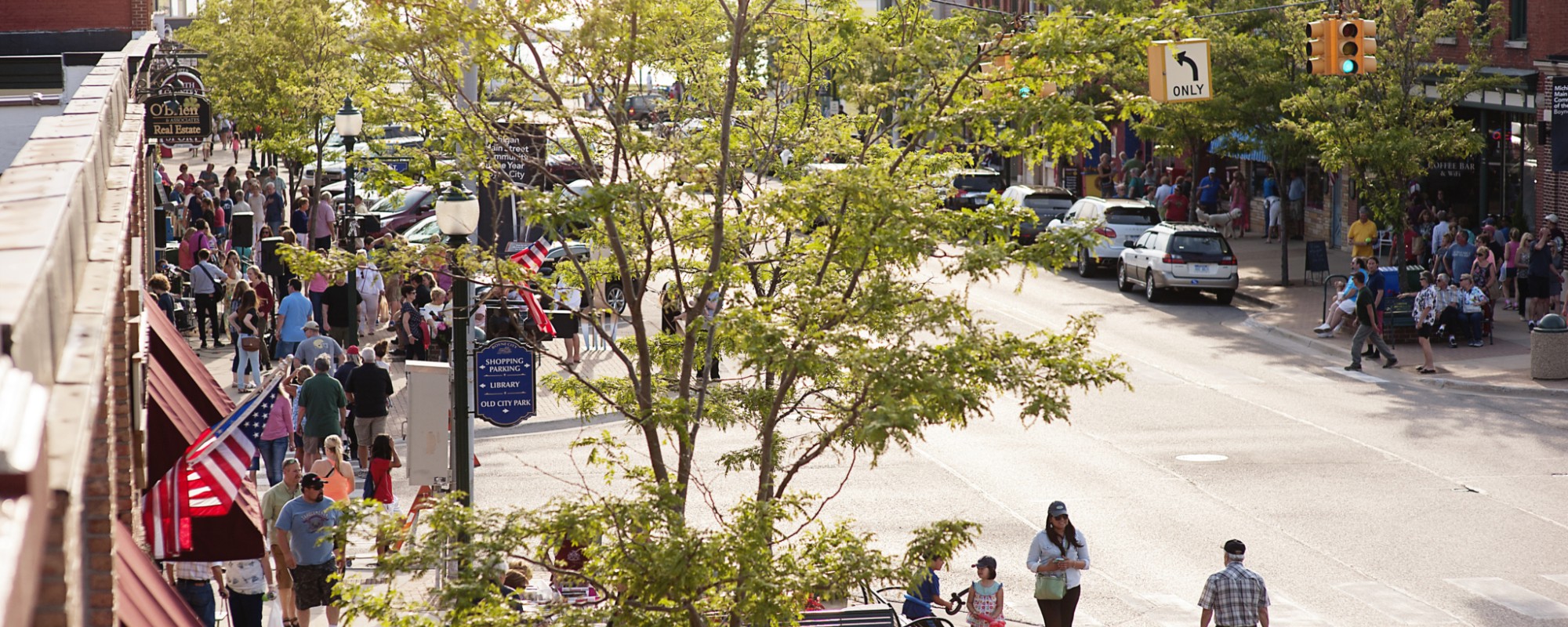 A busy downtown street from an upper floor vantage point.