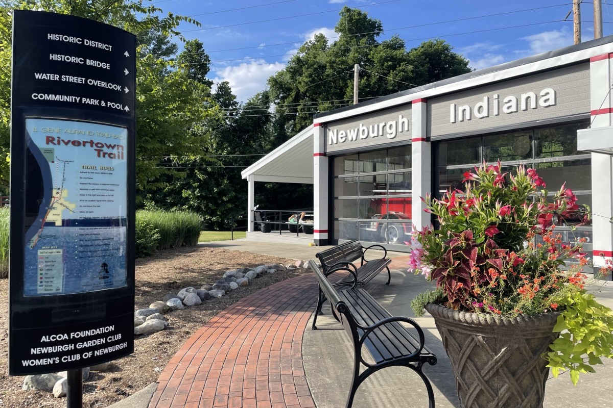 Wayfinding sign installed in a public seating area.