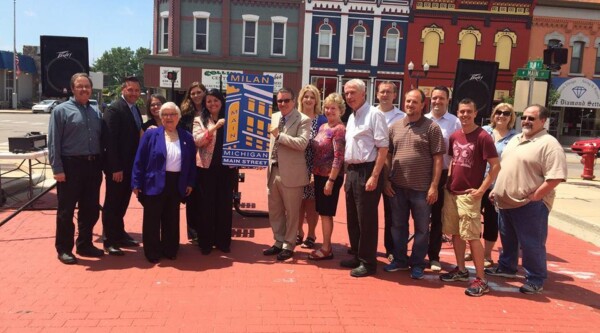 Milan Main Street leaders standing on Main Street with MSA staff.