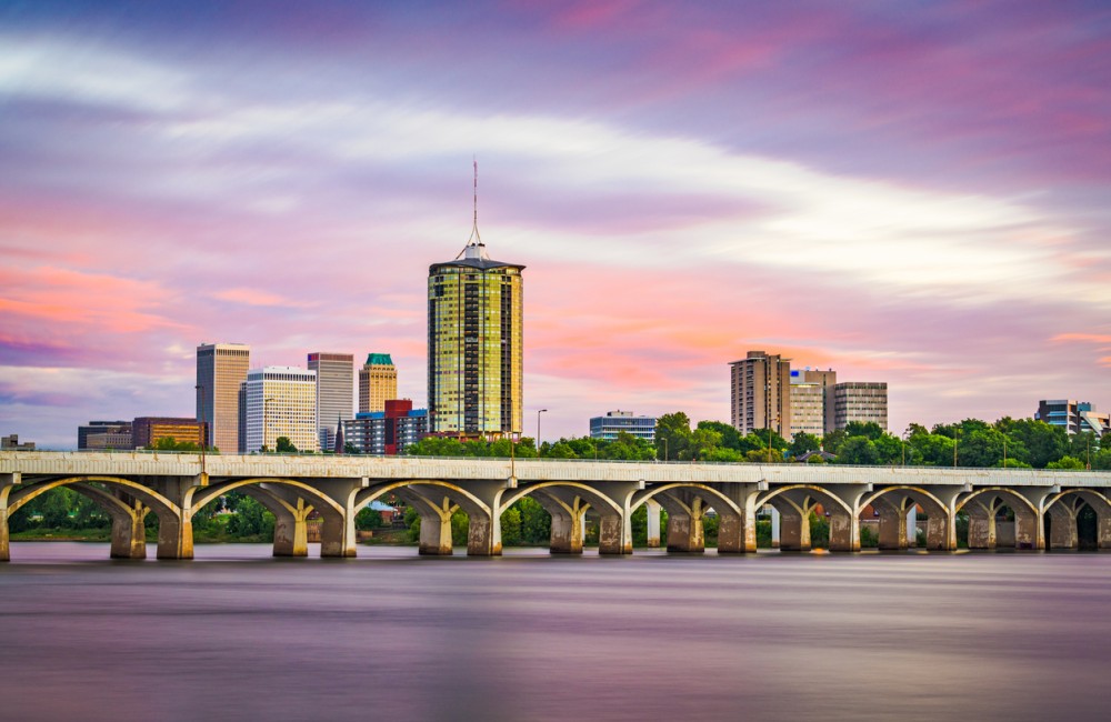 Tulsa, Oklahoma, downtown skyline on the Arkansas River at dusk.