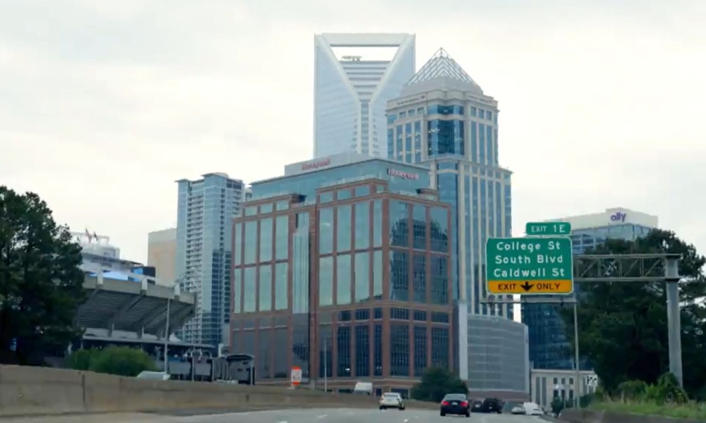 Ariel image of the city of Charlotte, North Carolina with logo overlays for Truist Foundation, Main Street America, and Living Cities