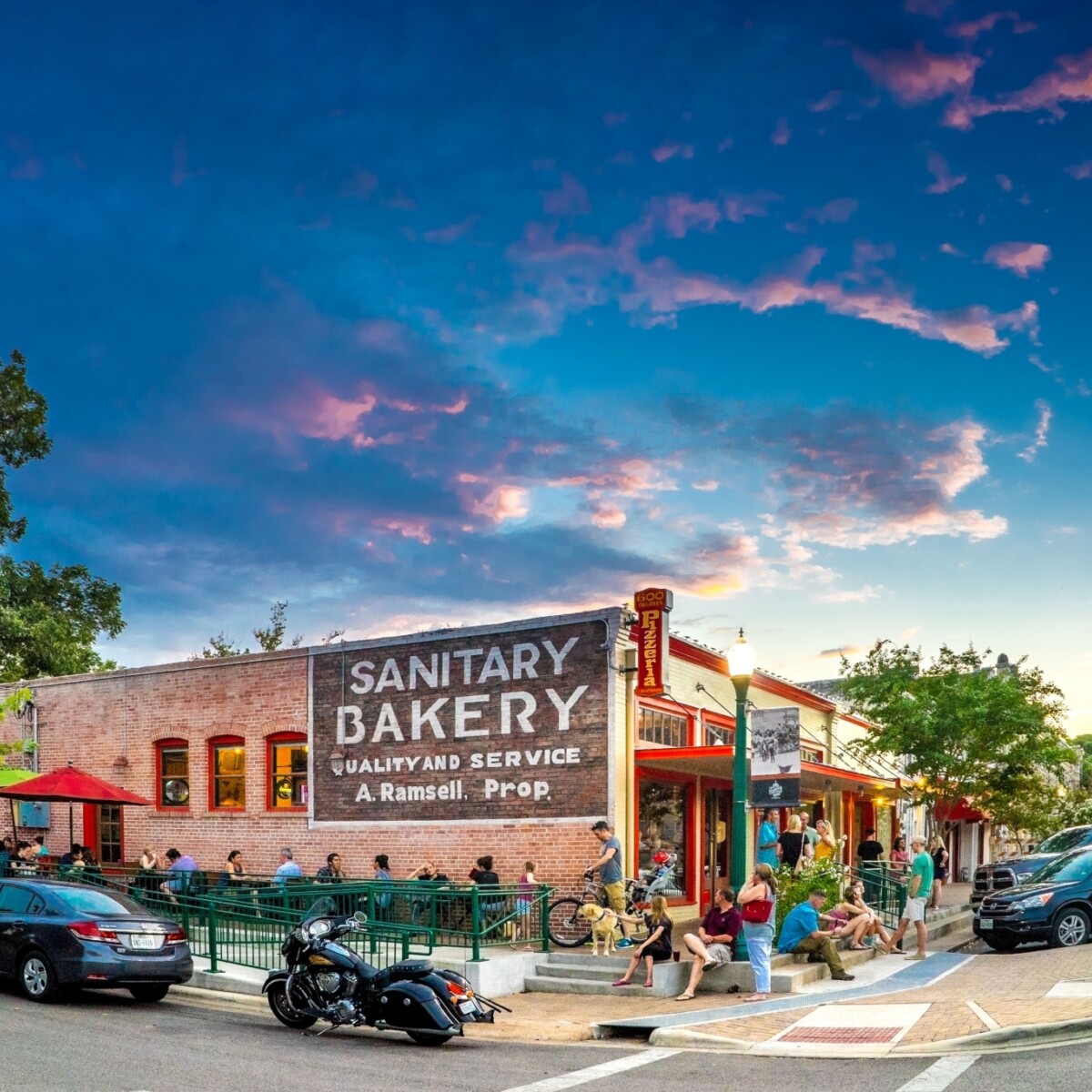 Downtown corner with brick building and large painted bakery sign