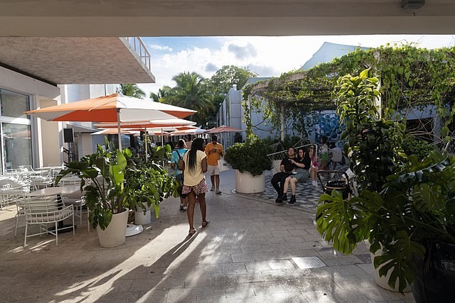 A tree-lined alley with outdoor dining
