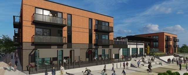 Mixed-use housing development with sidewalks, bike paths, ground floor retail, and apartments with balconies.