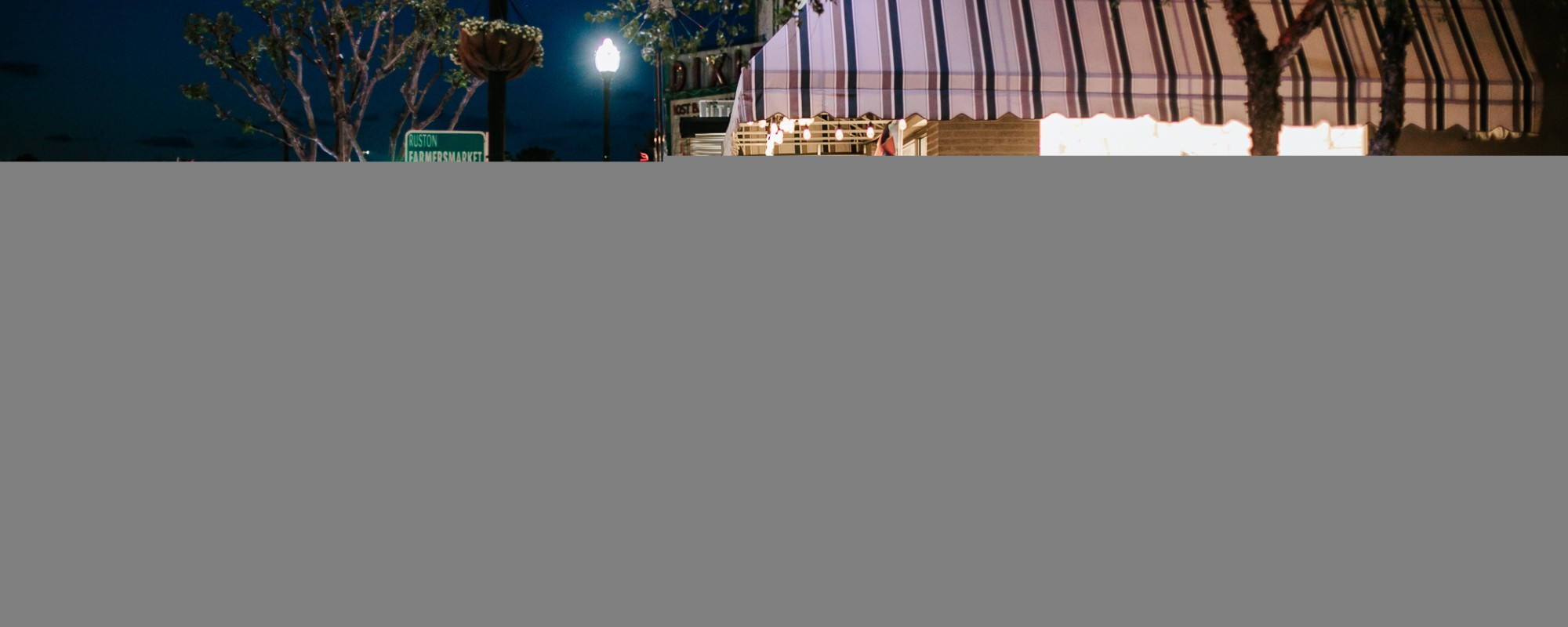 People attending a nighttime event in downtown Ruston