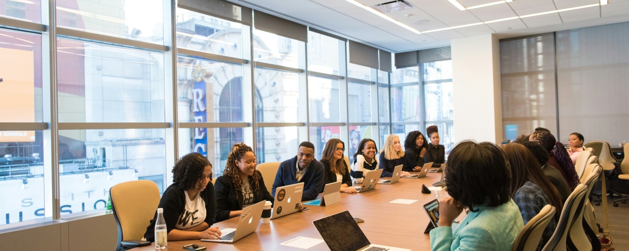 People sitting around a large table during a meeting