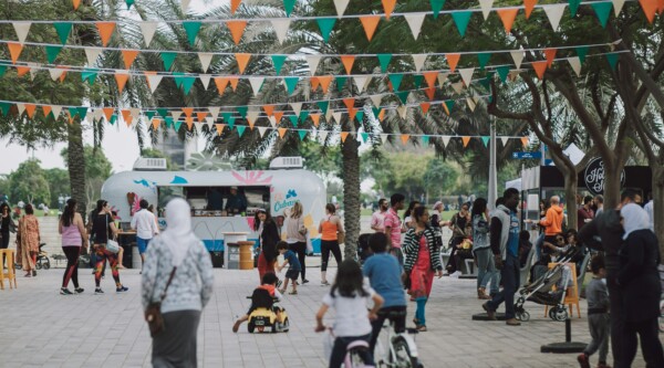 A downtown event with food tricks and colorful decorations