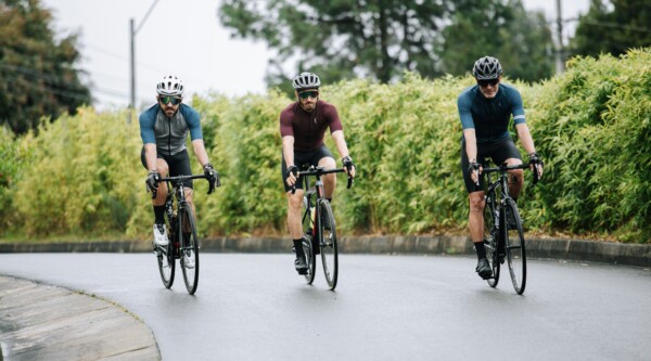 People cycling on a protected bike path