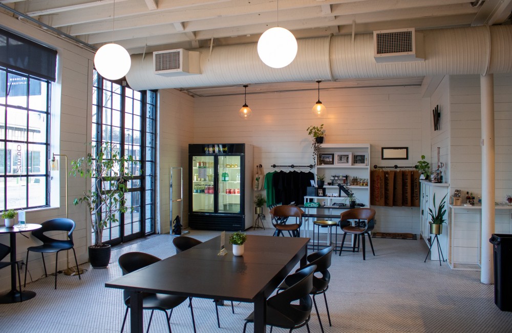 Rooms with large windows, open seating, and nooks with merchandise on display.