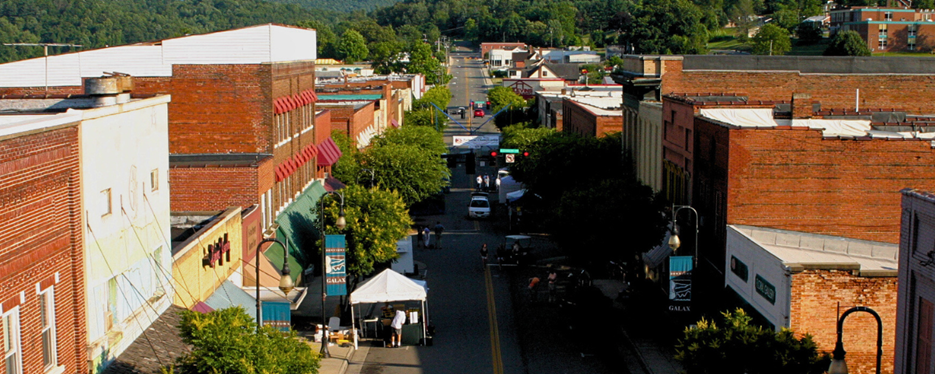 Aerial photo of a downtown street with red brick buildings