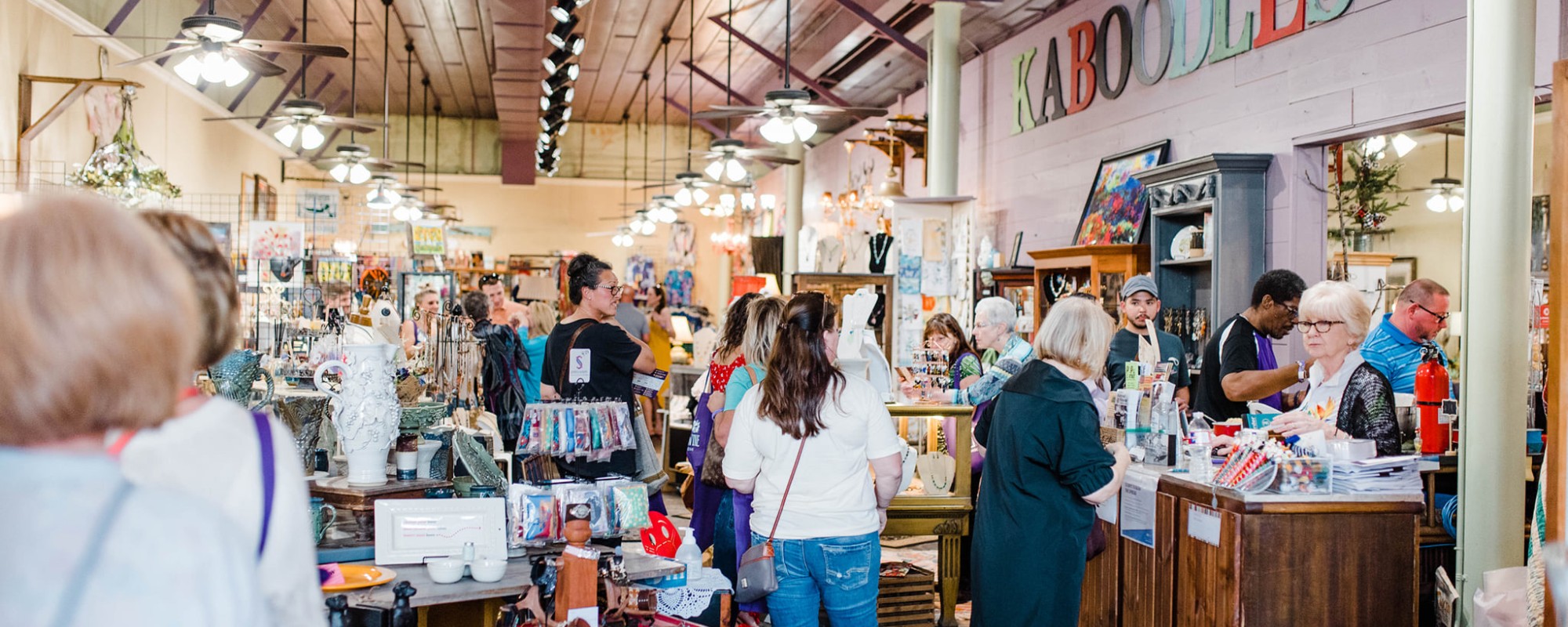 People shopping for artisanal goods in an eclectic local shop