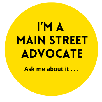 Yellow circle with the words "I'm a Main Street Advocate, ask me about it"