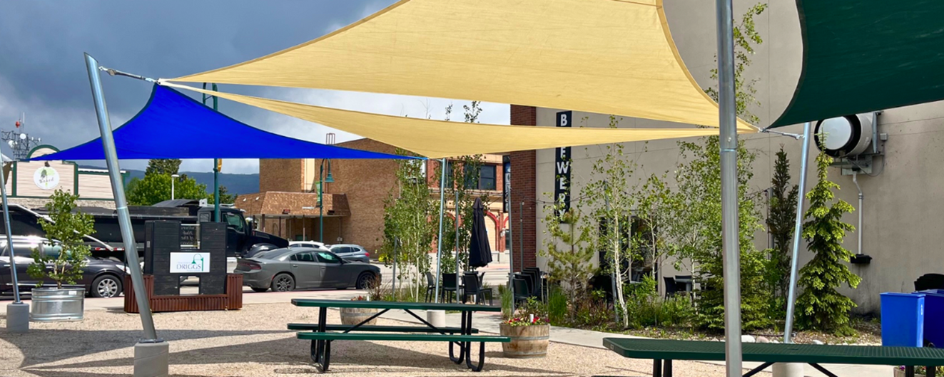 Shade sails cover outdoor seating