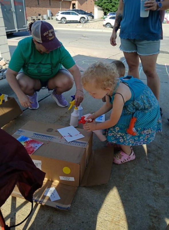 Kids enjoying a craft activity at a farmers market