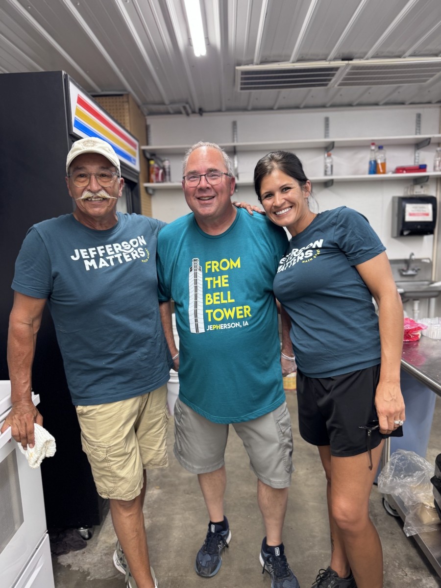 Three people pose wearing special Jefferson matters GAMSA t-shirts