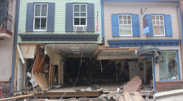 Historic structures missing the supporting wall and load-bearing columns after a flood.