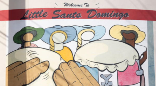 Mural depicting people playing drums, text reads "welcome to Little Santo Domingo"