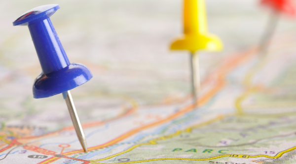 Colorful pins stuck into a map