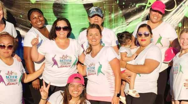 Members of LatinFit (a local Zumba Group) take a break from dancing to snap a picture